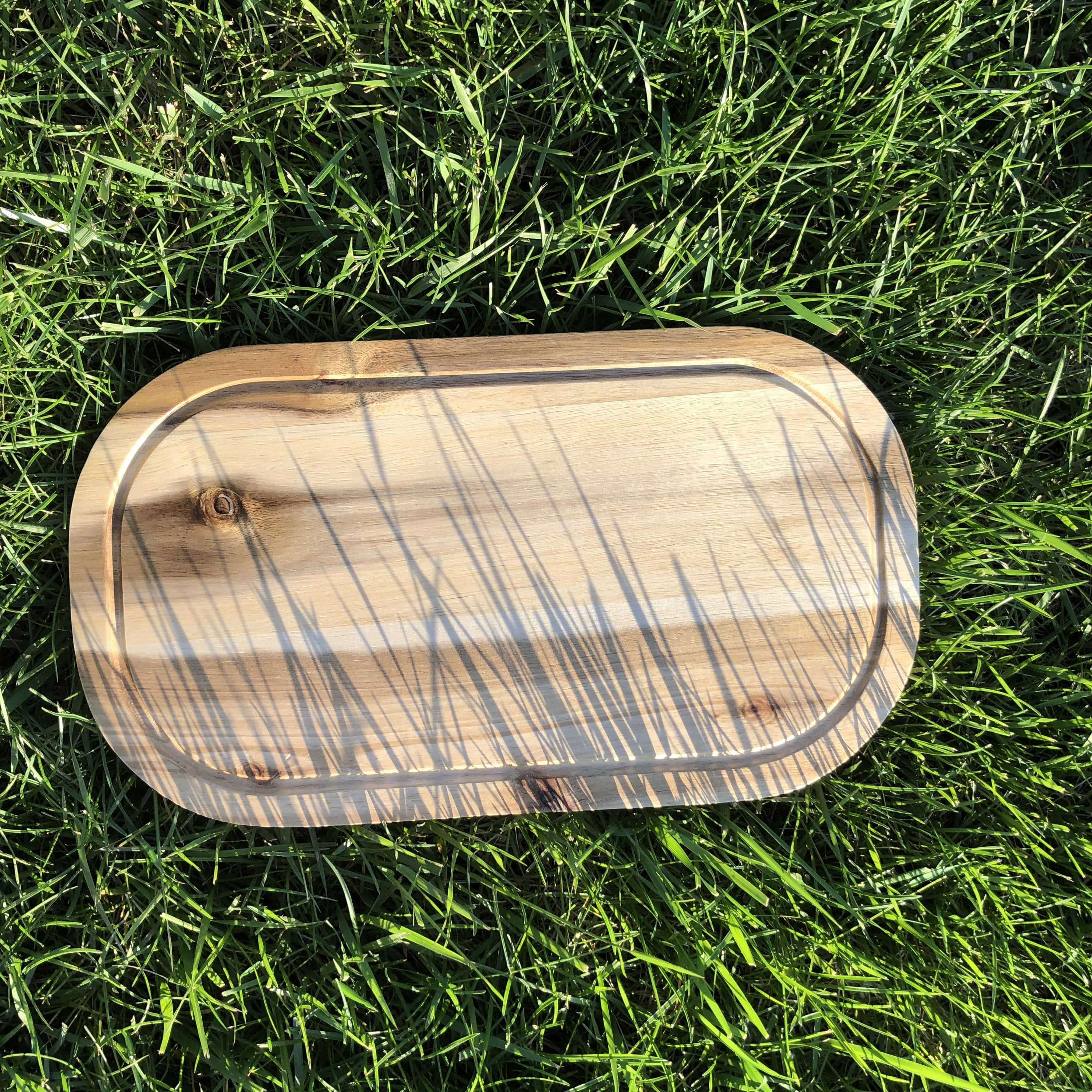 Rounded Cutting Board With Juice